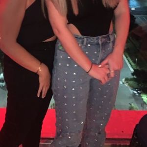 RHINESTONE STUDDED HIGH WASTED JEANS.